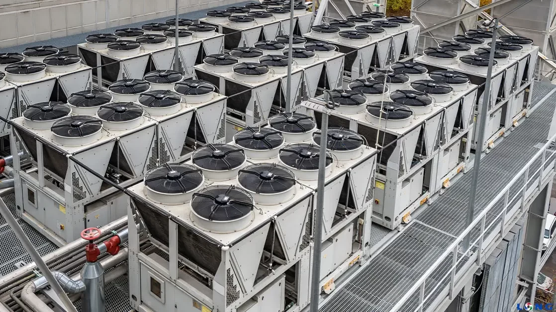 Large air-cooled chiller plant with rows of condenser fans serving an Alabama commercial facility